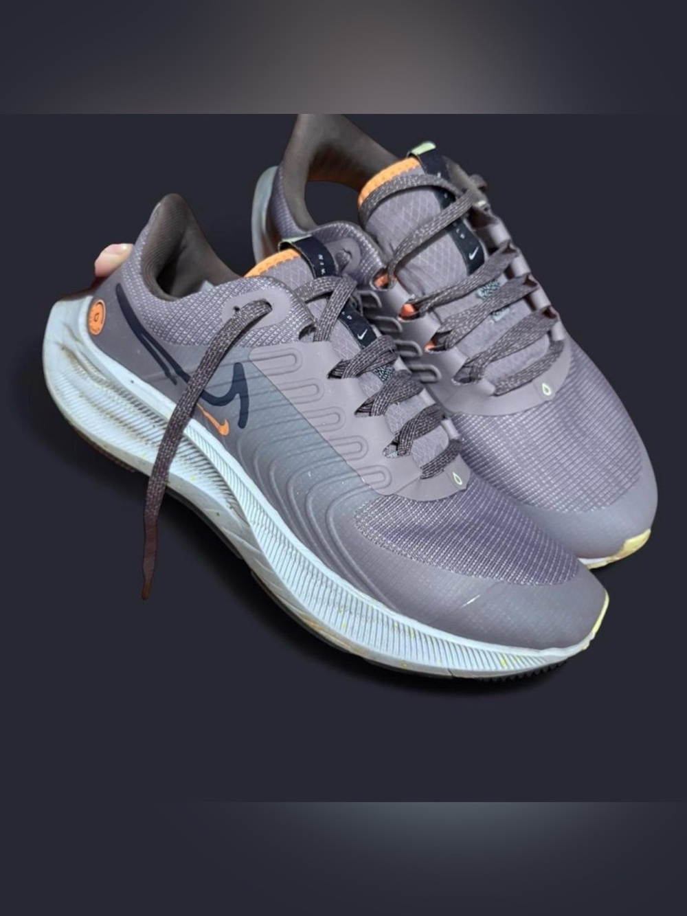 Nike woman’s Grey Athletic Running Shoes with Orange Accents
